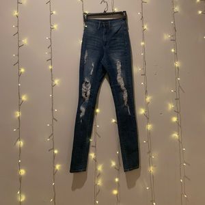 Ripped High waist skinny jeans . Size 3. NWOT.